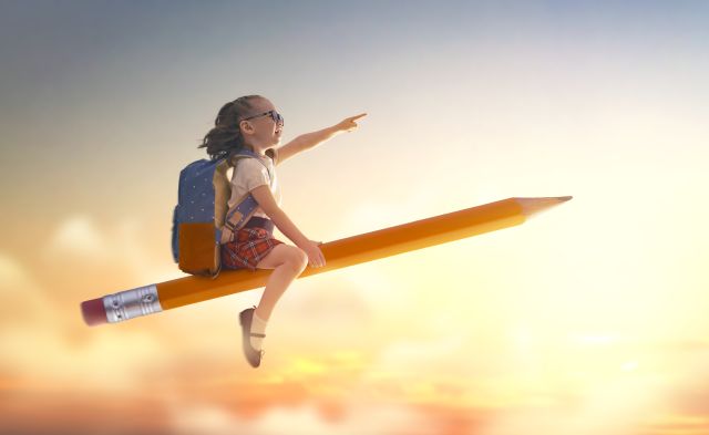 child flying on a pencil